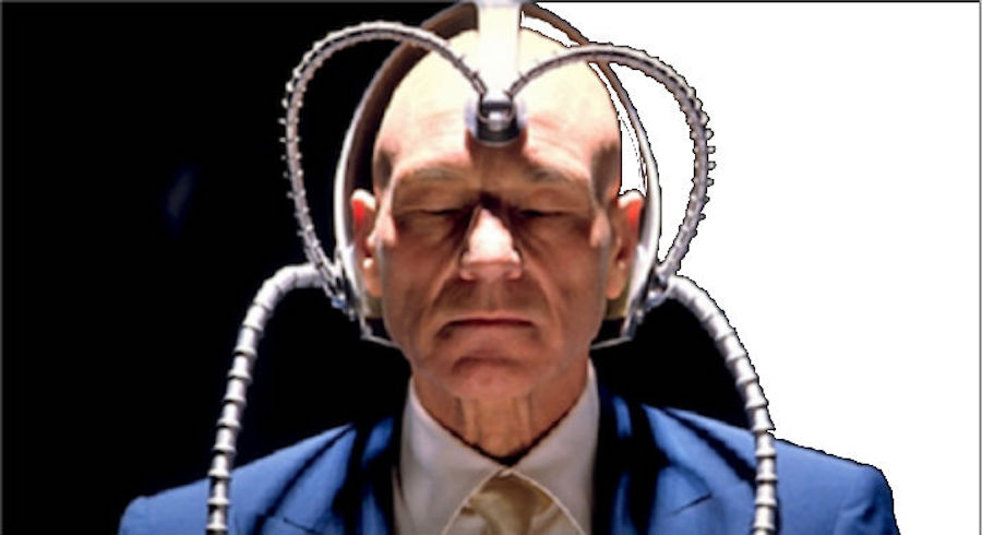 Charles Xavier from 'X-Men' sitting with his eyes closed wearing Cerebro.